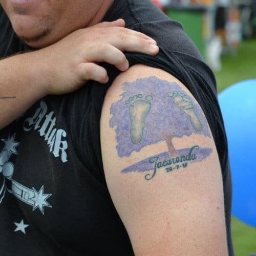Man with a Jacaranda Festival tattoo